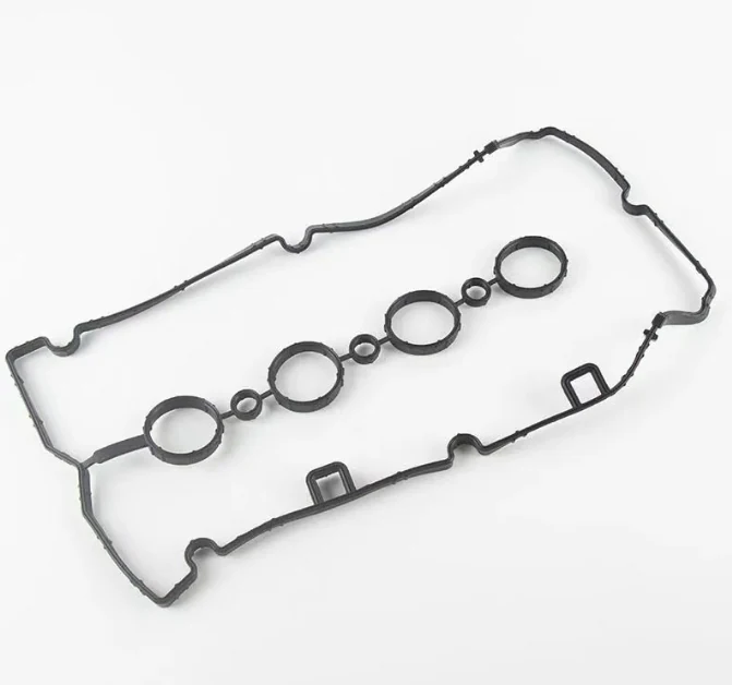 Rubber engine valve cover gasket with spark plug tube seals