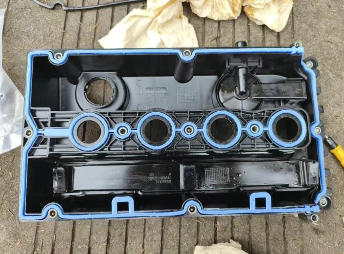 New valve cover gasket installed on a plastic valve cover