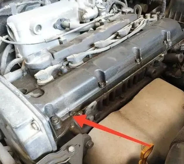 Valve cover gasket leaking oil down the side of an engine